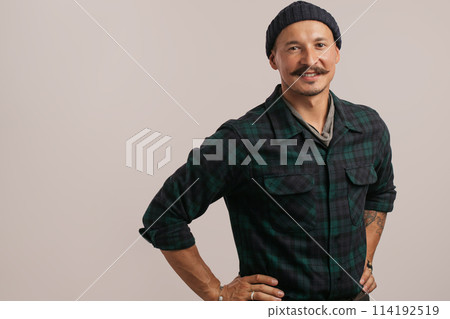 smart professional expert handyman wearing knitted hat isolated in studio 114192519