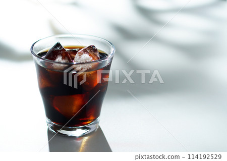 Sunlight filtering through the trees and iced coffee 114192529