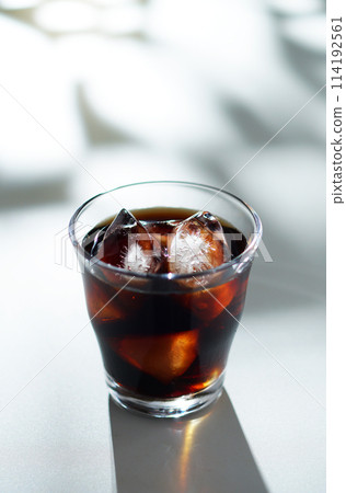 Sunlight filtering through the trees and iced coffee 114192561