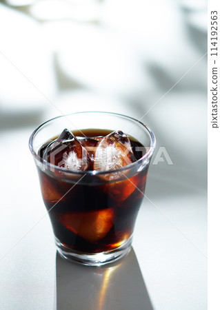 Sunlight filtering through the trees and iced coffee 114192563