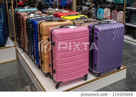 Large selection of colorful suitcases in store. Travel suitcases for sale at the mall. 114193689
