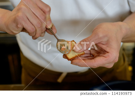 Chef's hands making canapes Chef's hands making canapes 114193973