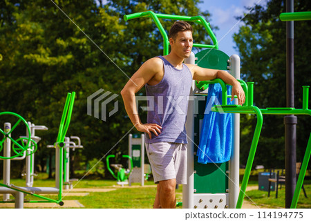 Man working out in outdoor gym 114194775