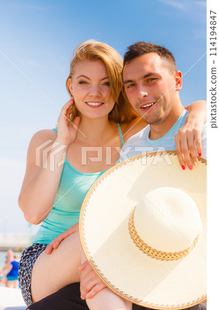 Man and woman sitting together outside Man and woman sitting together outside 114194847