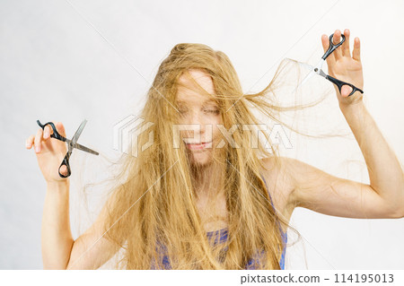 Girl with scissors for haircutting 114195013
