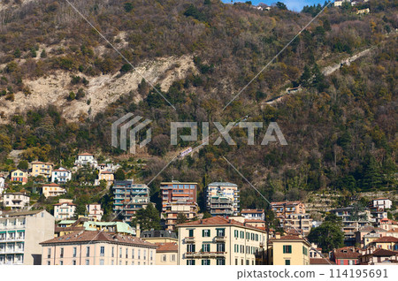 Italian city of Como in Alps mountains. Beautiful houses in mountain. Travel. Buildings. Tourism concept. Italy, Lombardy, the province of Milan. Como Lago. 114195691