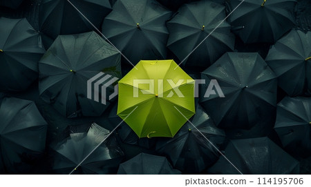 a yellow umbrella is surrounded by black umbrellas 114195706