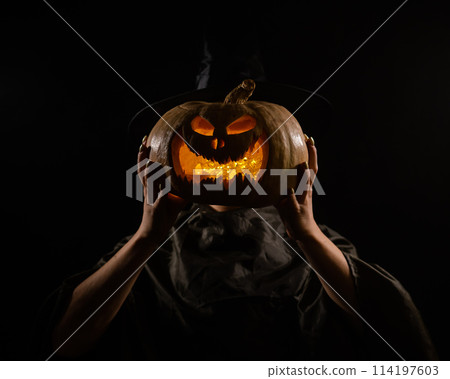 Pumpkin jack o lantern instead of a woman's head. Halloween Pumpkin jack o lantern instead of a woman's head. Halloween 114197603