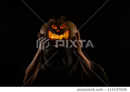 Pumpkin jack o lantern instead of a woman's head. Halloween 114197606