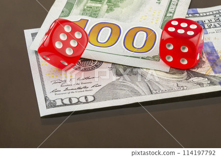 Two red dice poker on banknotes Two red dice poker on banknotes 114197792