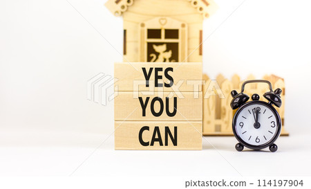 Motivational and Yes you can symbol. Concept words Yes you can on beautiful wooden blocks. Beautiful white background. Black alarm clock. Business motivational and Yes you can concept. Copy space. 114197904