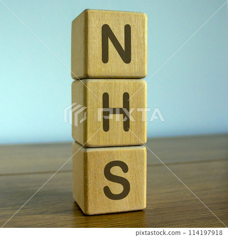 Concept word NHS (National Health Service) on cubes on a beautiful blue background. Concept word NHS (National Health Service) on cubes on a beautiful blue background. 114197918