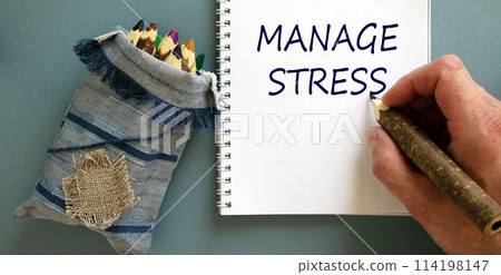 Manage stress symbol. Doctor writing concept words 'manage stress' on white note, isolated on blue background. Bunch of pencils stylized tree branch in bag. Psychological, manage stress concept. 114198147