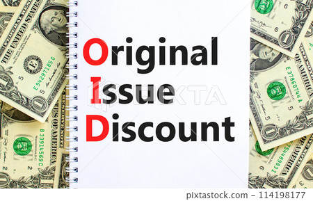 OID original issue discount symbol. Concept words OID original issue discount on beautiful white note. Beautiful dollar bills background. Business OID original issue discount concept. Copy space. 114198177