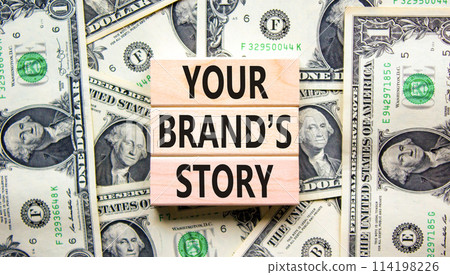 Branding your brand story symbol. Concept words Your brands story on beautiful wooden blocks. Dollar bills. Beautiful dollar bills background. Business branding your brand story concept. Copy space. 114198226