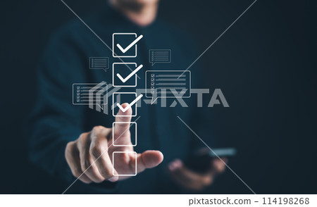Businessman interacting with digital checklist interface. Correct sign mark in checkbox for quality control and business approve project concept. Check mark, Filling out form checklist, Online exam, Businessman interacting with digital checklist interface. Correct sign mark in checkbox for quality control and business approve project concept. Check mark, Filling out form checklist, Online exam, 114198268