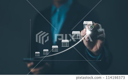 Franchise concept. Franchise Business Growth and Expansion Strategy Visualization. Entrepreneur visualizing franchise growth trajectory with increasing store icons on a digital upward trend graph. 114198373
