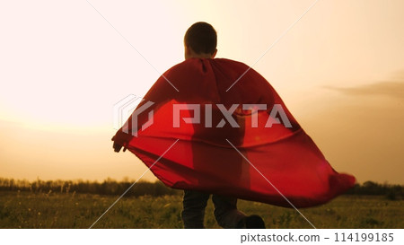 boy son child superhero game running park field sunset grass victory red cloak fancy dress, boy superhero costume, child red cape, kid sunset field, son playing hero, young masquerade outfit, little 114199185