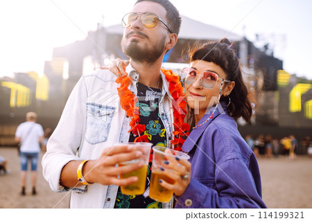 Couple with beer at music festival. Summer Beach party, holiday, vacation concept. 114199321