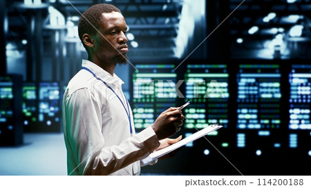 IT programmer using clipboard to assess supercomputer cybersecurity dangers arising due to unsecured network connections. Supervisor making sure high tech facility is invulnerable to malware attacks IT programmer using clipboard to assess supercomputer cybersecurity dangers arising due to unsecured network connections. Supervisor making sure high tech facility is invulnerable to malware attacks 114200188