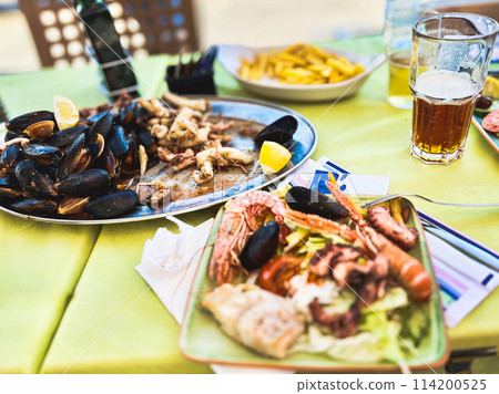 Seafood platter with musselspus, squid, squidpus Seafood platter with musselspus, squid, squidpus 114200525