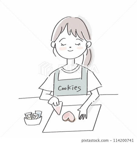 Smiling young woman making icing cookies 114200741