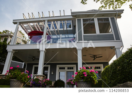 Modern Suburban Home with Outdoor Living Space, Upward View 114200853
