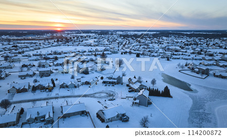Aerial Winter Sunset Over Snowy Suburban Neighborhood Aerial Winter Sunset Over Snowy Suburban Neighborhood 114200872
