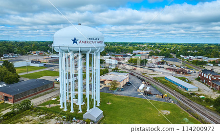 Indiana American Water tower aerial on bright summer day with cloudy blue sky, Muncie Indiana American Water tower aerial on bright summer day with cloudy blue sky, Muncie 114200972