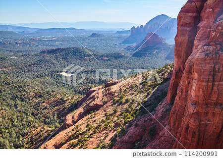 Aerial View of Sedona Red Rock Formations and Forested Valley 114200991