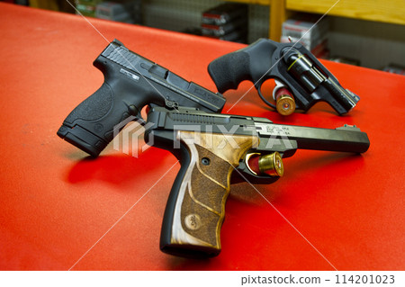 American Made Handguns on Vibrant Red Display - Indoor Shooting Range American Made Handguns on Vibrant Red Display - Indoor Shooting Range 114201023