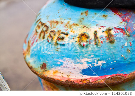 Close-Up of Weathered Metallic Surface with Free Spirit Embossing Close-Up of Weathered Metallic Surface with Free Spirit Embossing 114201058