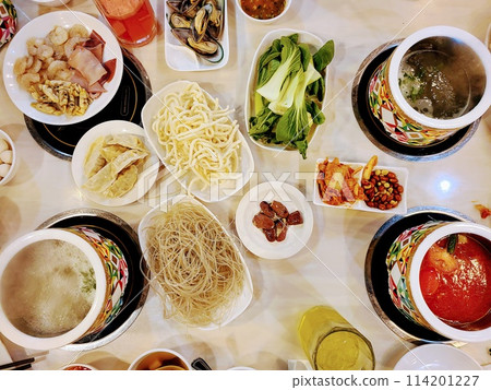 Communal Hot Pot Dining Experience with Fresh Ingredients, Overhead View 114201227