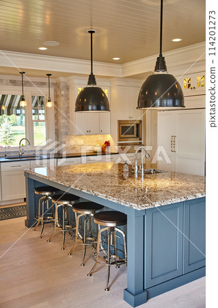Modern Kitchen with Blue Island and Industrial Lighting 114201273