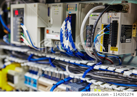 Industrial Control Panel with Network Cables and Safety Warning 114201274