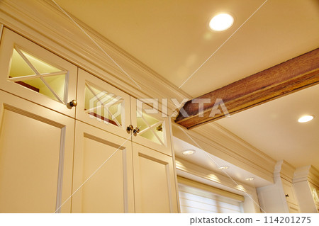 Elegant Residential Interior with Rustic Beam and Refined Cabinetry Elegant Residential Interior with Rustic Beam and Refined Cabinetry 114201275