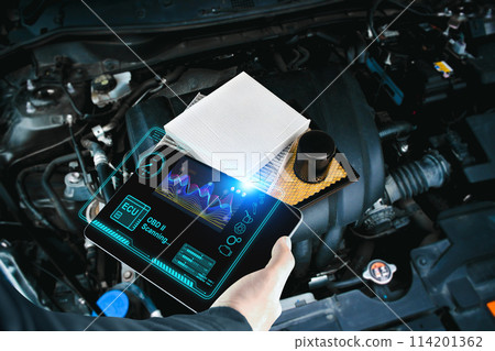 Car mechanic checking ECU electronic control unit with OBD or OBD2 wireless scanner tool 114201362