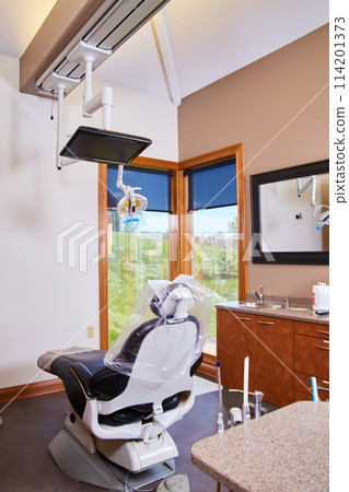 Modern Dental Office Interior with High-Tech Chair and Equipment Modern Dental Office Interior with High-Tech Chair and Equipment 114201373