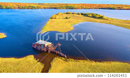 Aerial View of Abandoned Quincy Dredge in Autumn Lake Landscape Aerial View of Abandoned Quincy Dredge in Autumn Lake Landscape 114201451