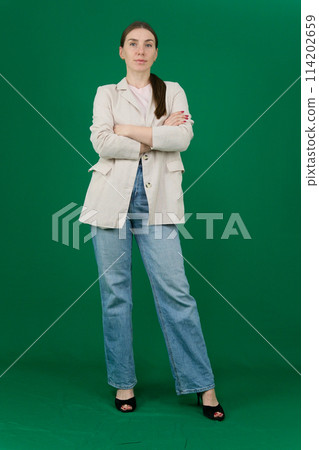 Beautiful young woman on green background Beautiful young woman on green background 114202659