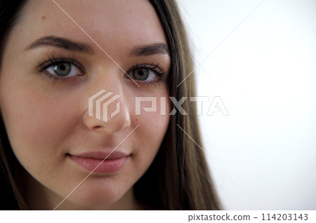 beautiful face of a young girl big high forehead long hair lips bow close-up european ukrainian nation Portrait of attractive young woman in the street beautiful face of a young girl big high forehead long hair lips bow close-up european ukrainian nation Portrait of attractive young woman in the street 114203143