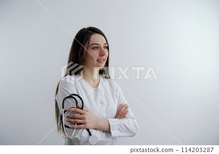 Image of happy young business woman posing isolated over grey wall background. Trainee doctor with pads and period calendar on background Image of happy young business woman posing isolated over grey wall background. Trainee doctor with pads and period calendar on background 114203287