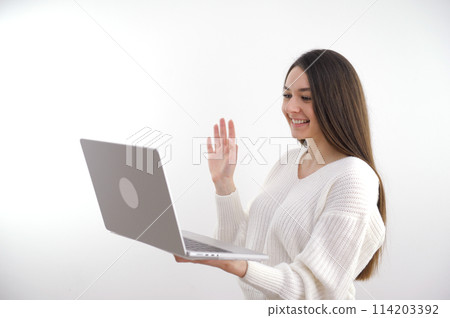 Photo of joyful happy positive mature woman wave hello computer online meeting indoors inside house home Photo of joyful happy positive mature woman wave hello computer online meeting indoors inside house home 114203392