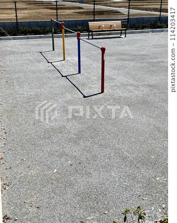 Horizontal bars and benches in an empty park 114203417