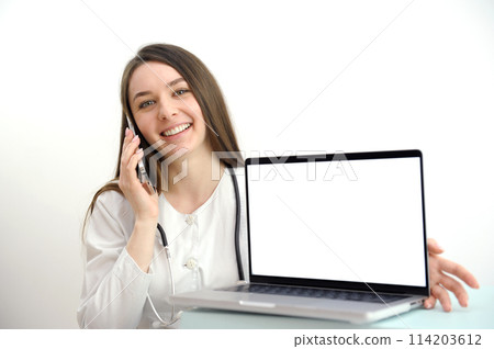online medicine on the phone female doctor consulting a patient pleasant communication to help recovery patient gratitude laptop with a white screen in a hospital on a white background online medicine on the phone female doctor consulting a patient pleasant communication to help recovery patient gratitude laptop with a white screen in a hospital on a white background 114203612