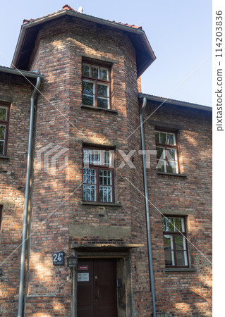 [Poland] Exterior of the red brick building at Auschwitz-Birkenau concentration camp 114203836