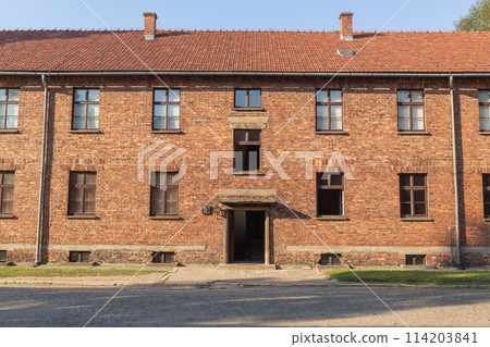 [Poland] Exterior of the red brick building at Auschwitz-Birkenau concentration camp 114203841