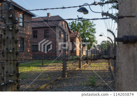 A barbed wire fence around the Auschwitz-Birkenau concentration camp in Poland 114203874