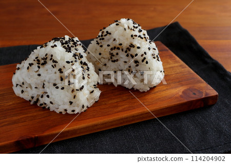 Black sesame rice balls on table background Black sesame rice balls on table background 114204902