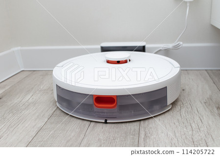 robot vacuum cleaner at the charging station. 114205722